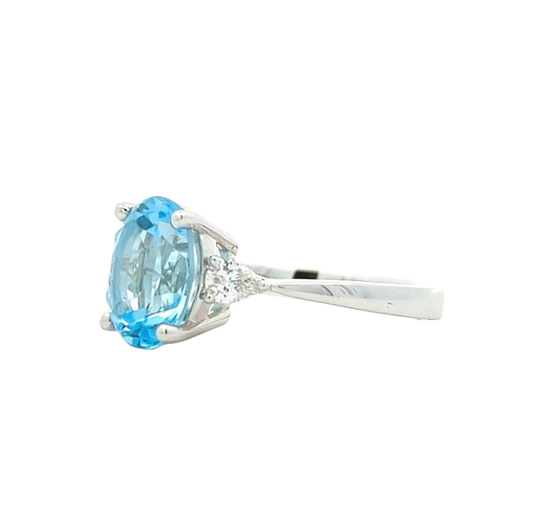 18KT White Gold Topaz and 0.23ctw Diamond Ring