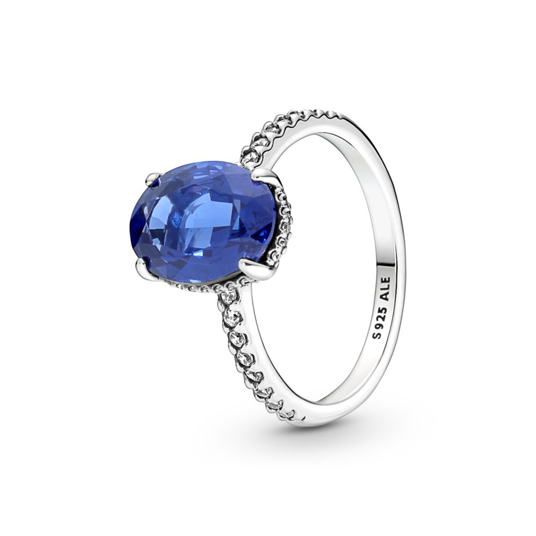 Sterling silver ring with princess blue crystals