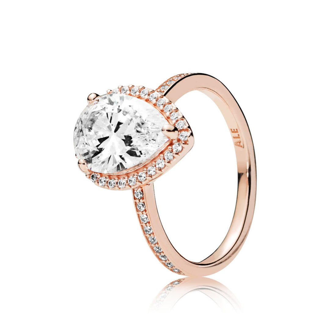 Ring in Rose with 1 claw-set pear-cut CZ and 46 bead-set clear CZ
