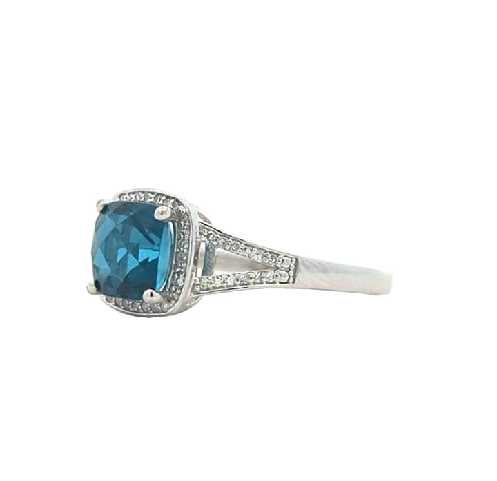 14KT White Gold Blue Topaz and 0.15ctw Diamond Ring